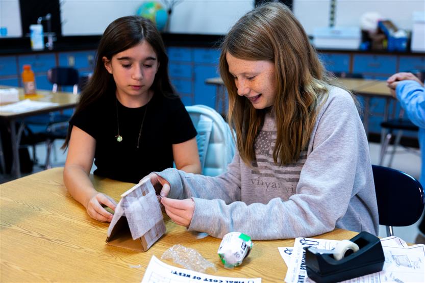 Students build penguin nests during an experiment